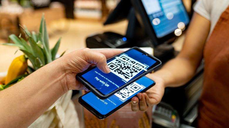 Person paying with QR code