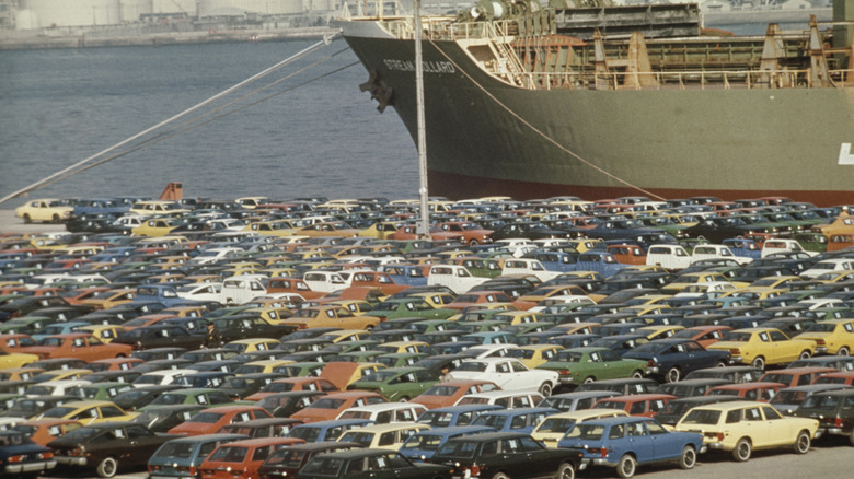 Japanese cars parked in front of ship