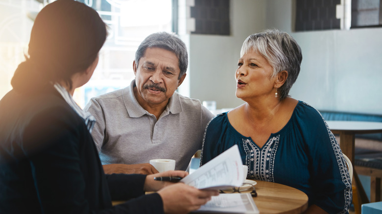 older couple speaking with financial advisor