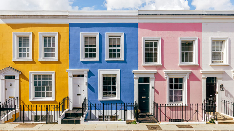 The front facades of colorful row homes.