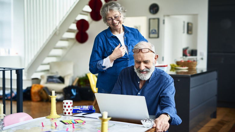 Older couple looking at laptop together