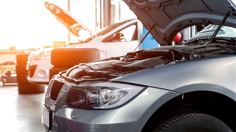 Cars in repair shop garage