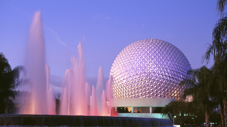 The signature dome at Epcot Center with several water fountains in the foreground.