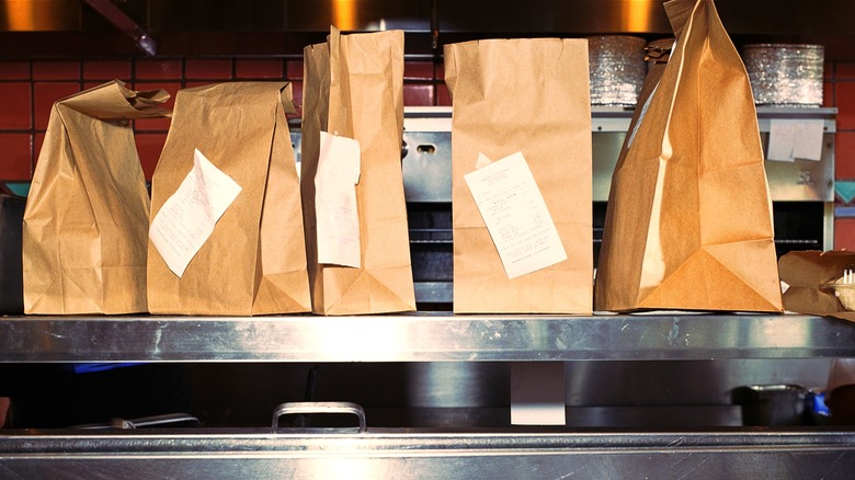 Restaurant takeout bags lined up