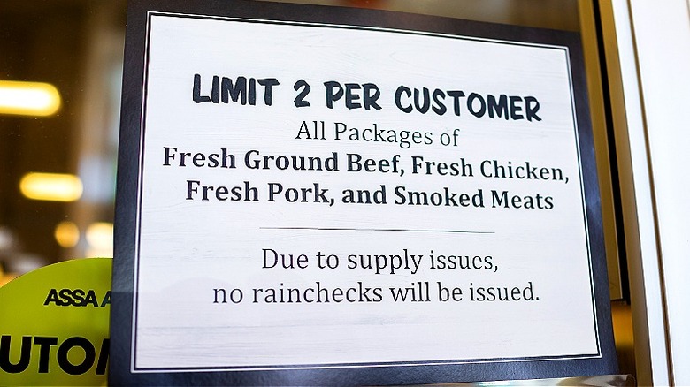 A rain check sign indicating a limit of '2 per customer'