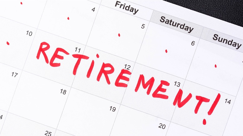 A generic calendar page on white paper with black numbers and the word 'Retirement!' handwritten in red ink