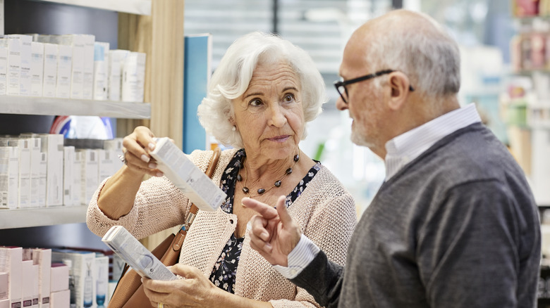 senior couple shopping at drug store