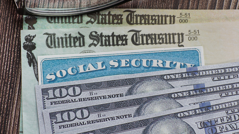 social security payment checks with $100 biils