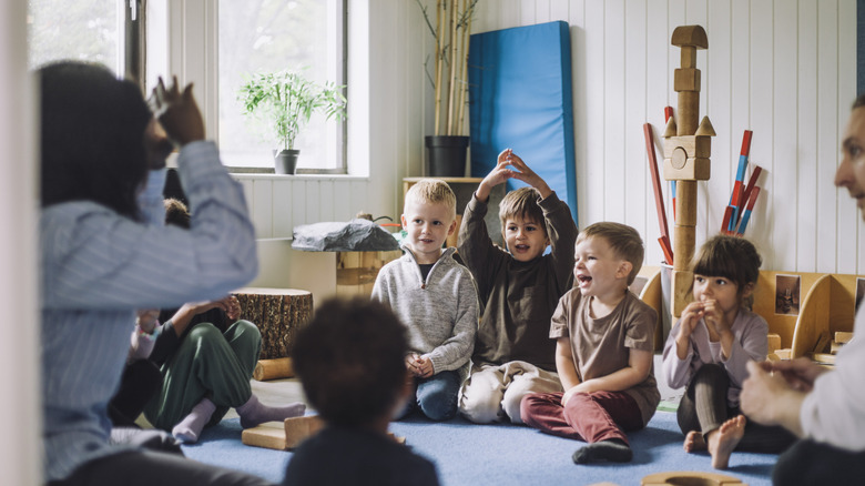 A group of children laughing and having fun at a daycare center