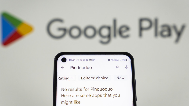 Phone screen showing Pinduoduo app removal from Google Play