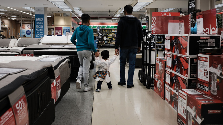 People shop in a Sears store on October 15, 2018