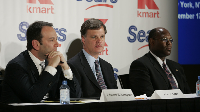 Edward Lampert, left, speaks during a news conference to announce the merger of Kmart and Sears