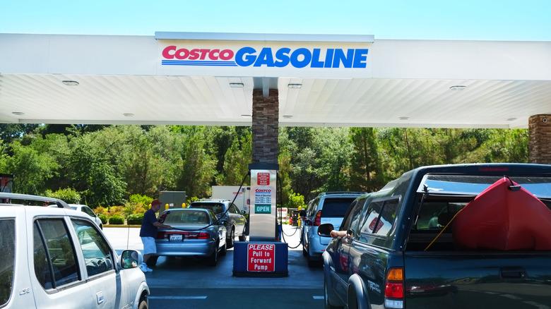 A line up of vehicles at a Costco gasoline station