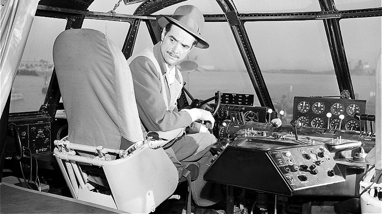 Howard Hughes in plane cockpit