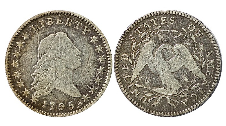 Head and tails of dollar coin shown on white