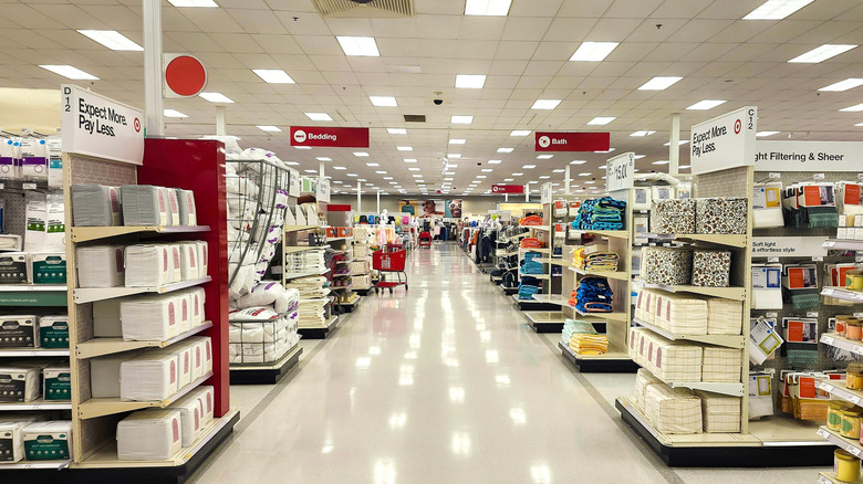 Brightly lit interior of a Target with bedding and bath sections