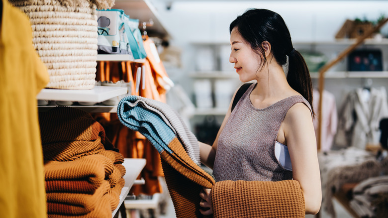 A woman shopping for home decor and necessities