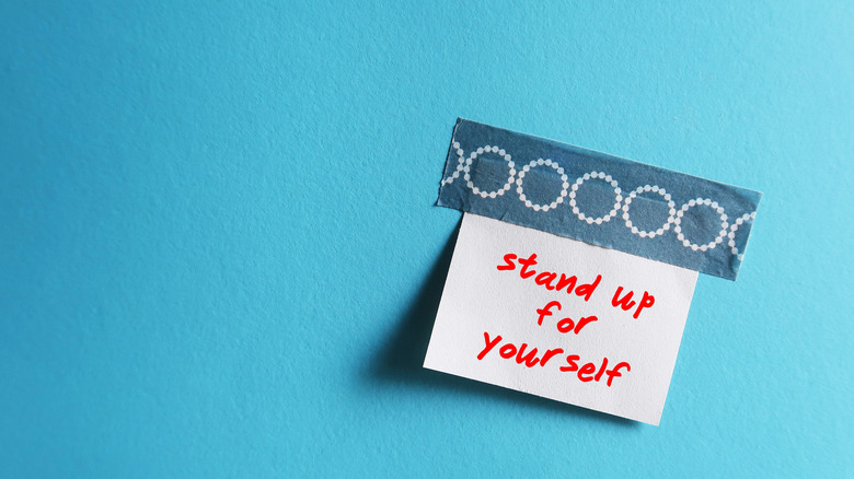 a note reading: Stand up for yourself