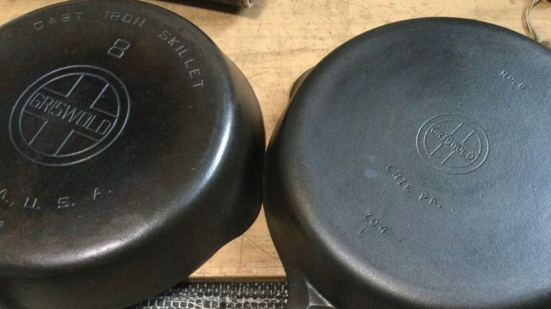 The bottoms of two vintage Griswold skillets.