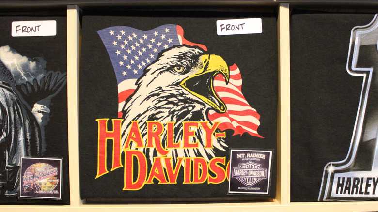 A display of Harley Davidson shirts, with an eagle and flag variety in the center.