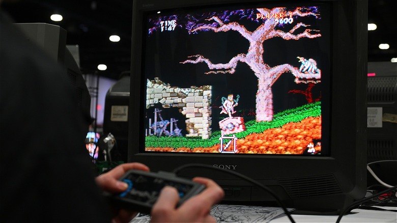 Person playing retro video game