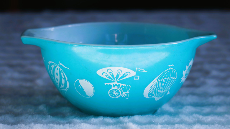 Blue vintage Pyrex mixing bowl printed with rare hot air balloons design.