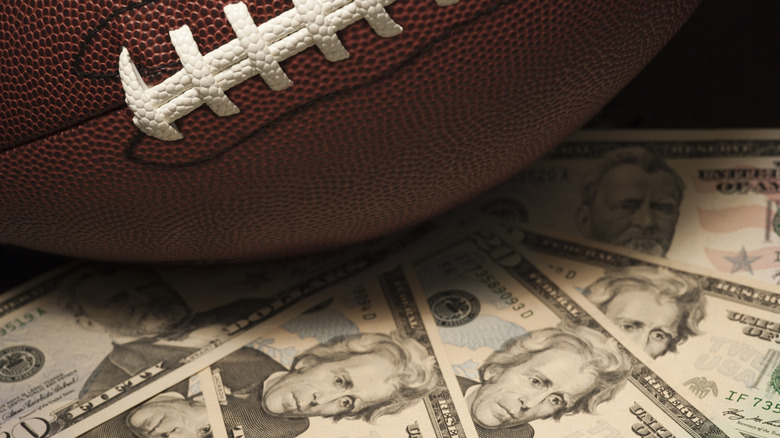 A football sitting on money