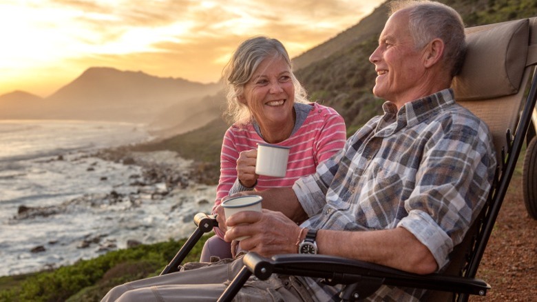 Retired couple sitting outdoors