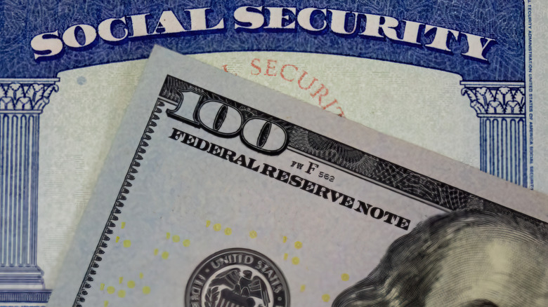 $100 bill and social security card