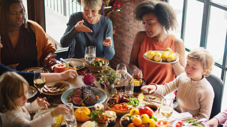 Family and friends celebrate festive meal at restaurant.