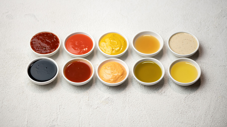 Different sauces, mayonnaise, mustard, soy sauce, oil and ketchup