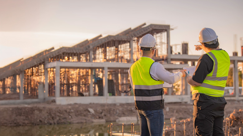 Two engineers working at job site