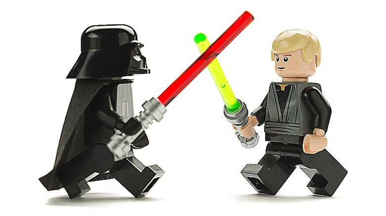 Lego Darth and Luke Skywalker engaged in battle