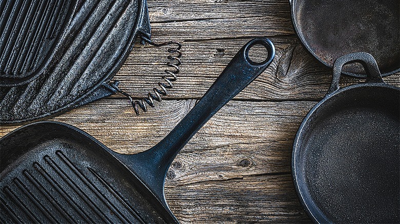 Cast-iron skillets on wooden table