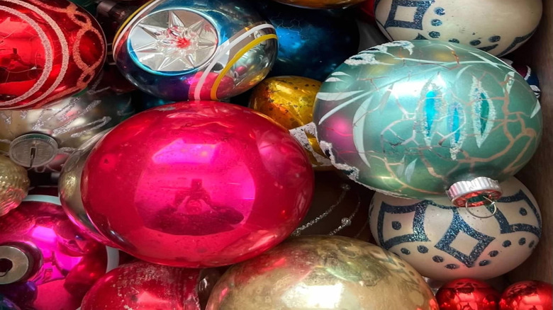 A collection of shiny Christmas ornaments in various colors and styles.