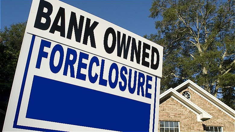 Home "BANK OWNED FORECLOSURE" sign