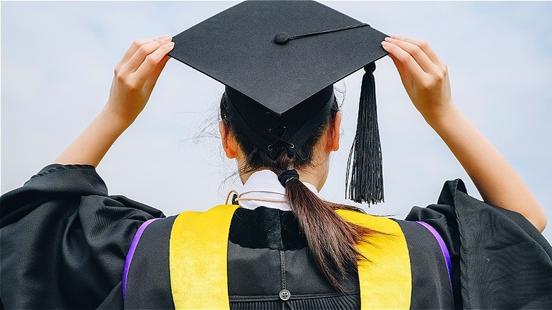 Graduate wearing cap and gown