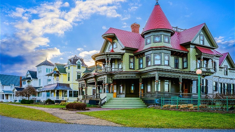 Sun sets behind nice houses