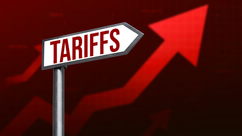 Tariffs sign with a rising red arrow