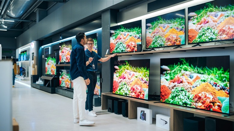 Customer shopping for TVs