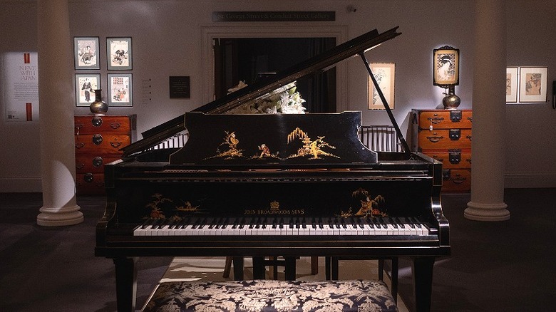 A Steinway & Sons grand piano in the center of a room