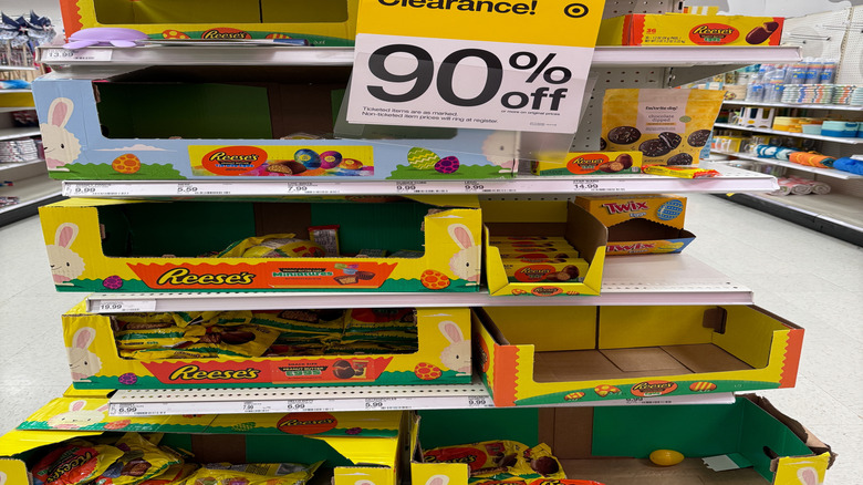 A Target end cap with a yellow Clearance! sign announcing a deep discount on holiday Reese's cups.