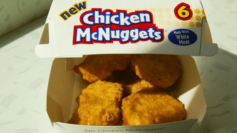 An order of six-piece chicken McNuggets in a carton.