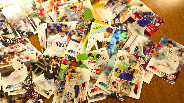 Baseball cards piled on table