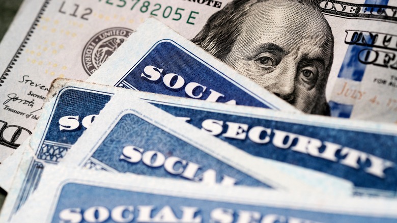 Social Security cards and $100 bill