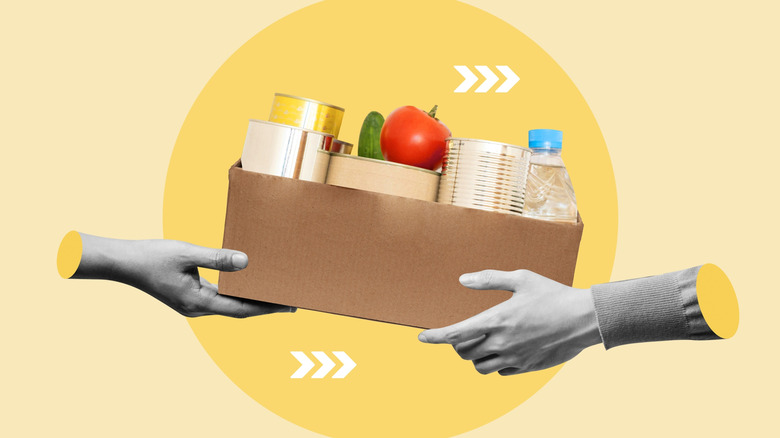 An artistic representation of grocery delivery as one hand delivers a box of groceries to a receiving hand