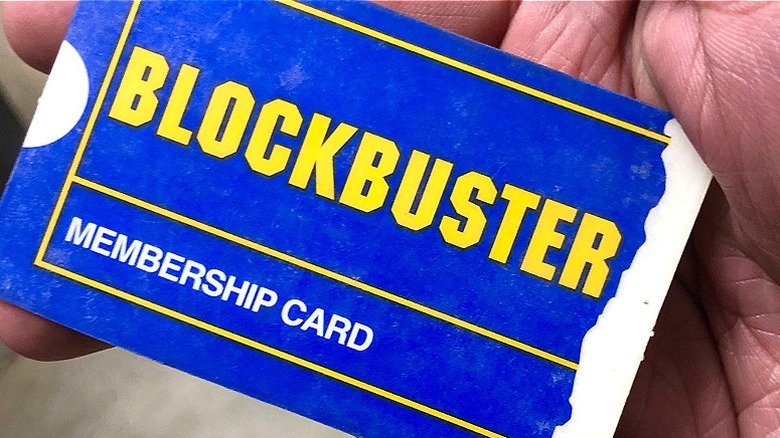 Hand holding Blockbuster membership card