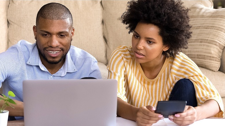 Couple looking at laptop together