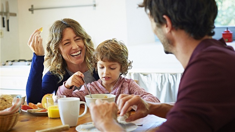 Family of three having breakfast