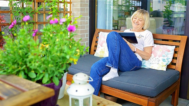 Older woman on patio smiling